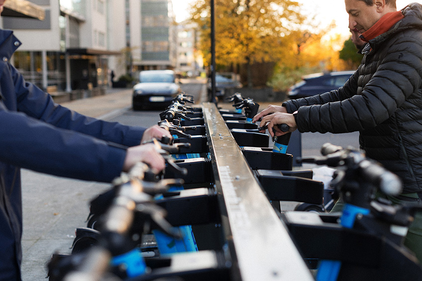 Shared scooters docked in Standab charging infrastructure