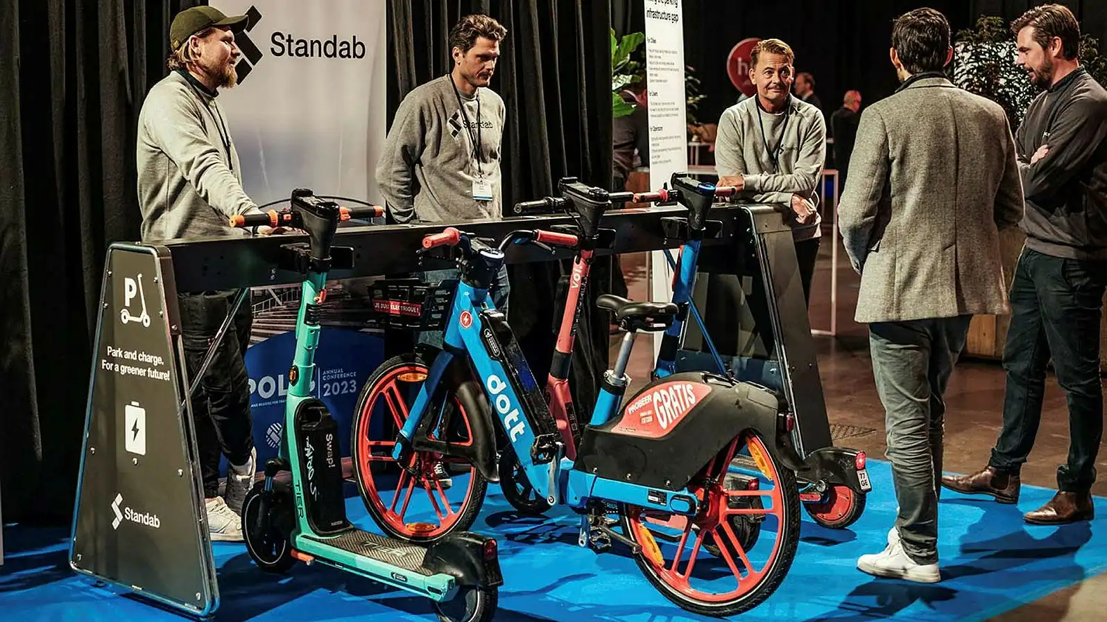 Standab park-and-charge infrastructure displayed with shared micromobility vehicles