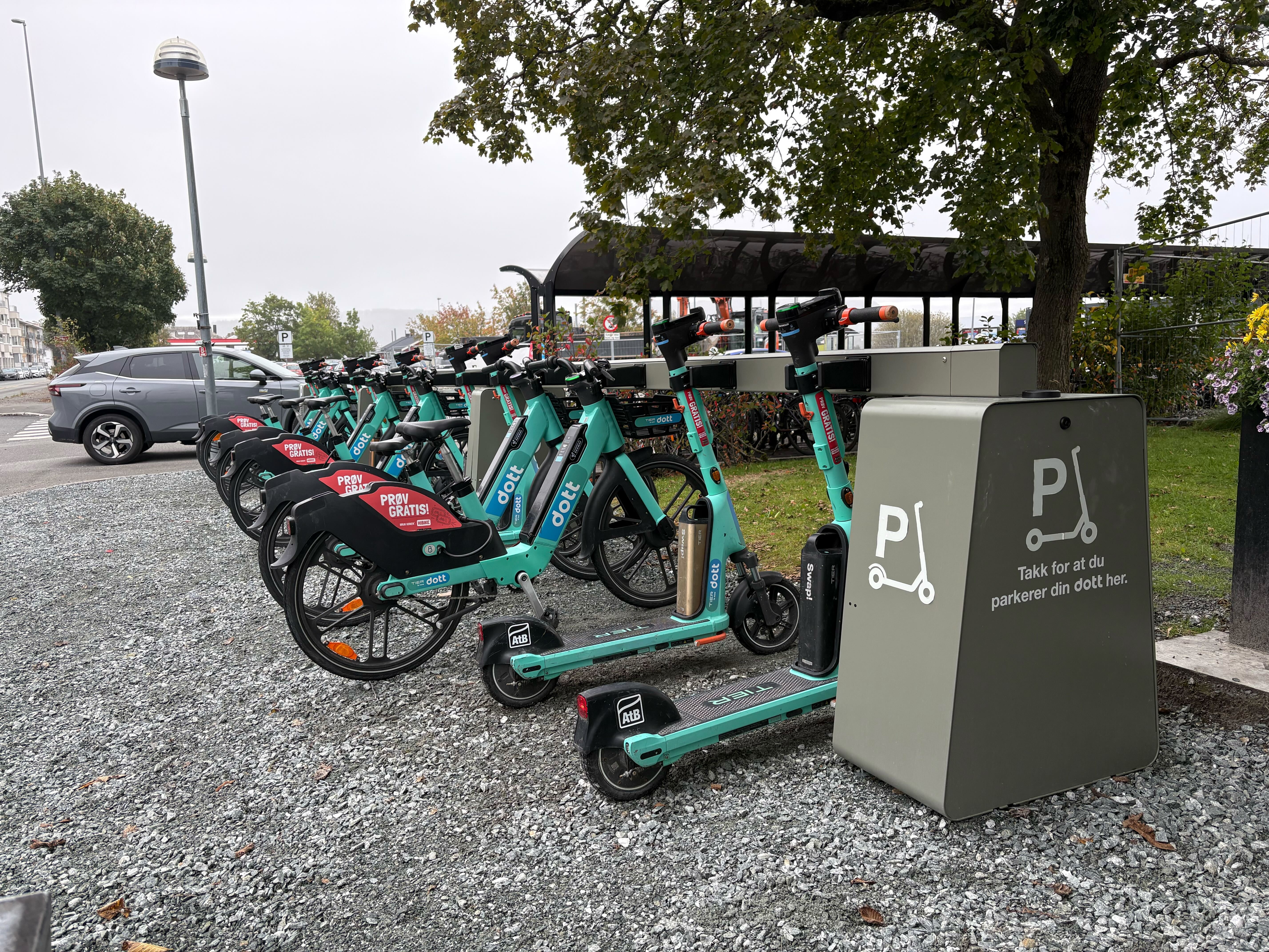 Dott scooters docked in Standab charging stations in Stjørdal